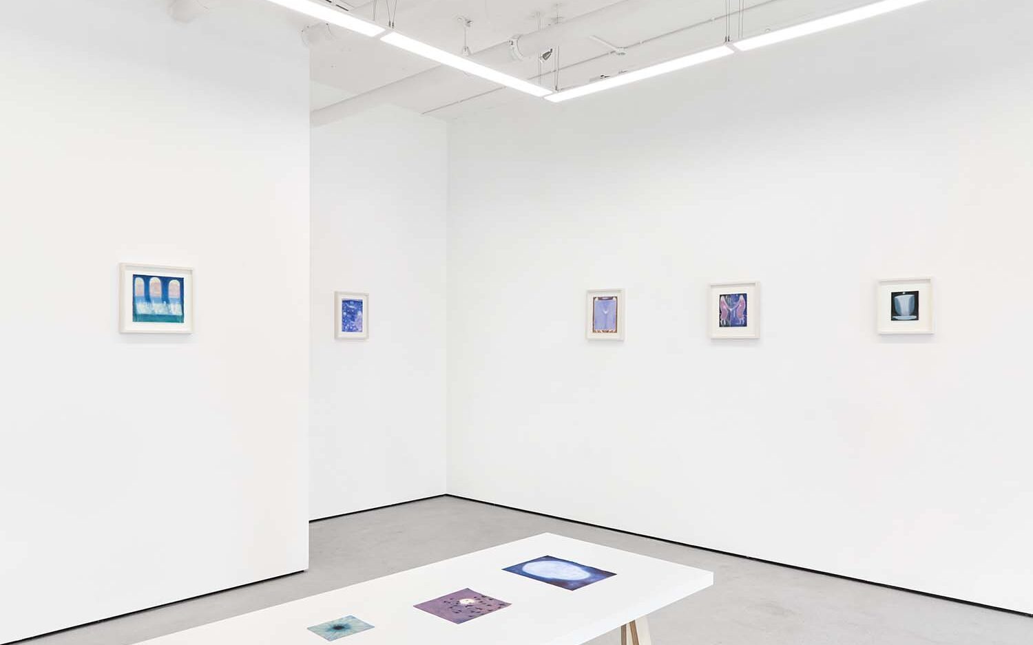 Framed artworks in exhibition